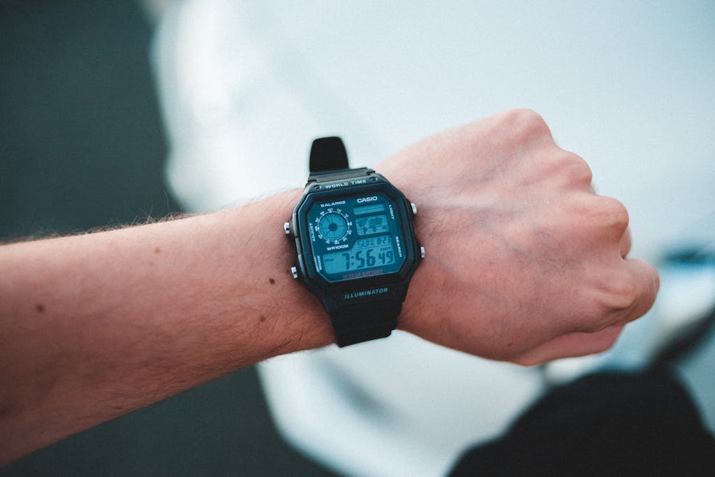 Man demonstrating modern electronic wristwatch